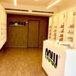 The main aisle of the store lined with NOW Foods supplements