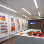 NOW Foods products displayed on illuminated shelving inside the Limassol store