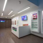 Inside the NOW Supplements Store in Limassol, with backlit shelving displaying the NOW Foods range